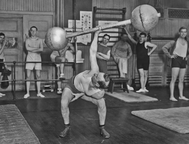 Men doing a bent press